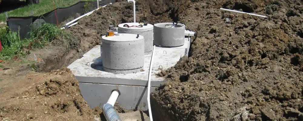 Septic system repair and installation site with tank access ports in Boulder, CO